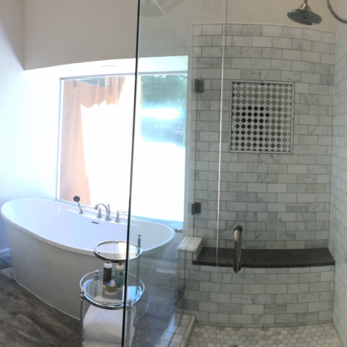 Modern bathroom with a bathtub and a walk-in shower